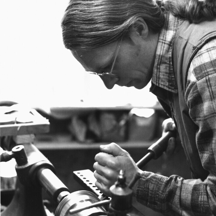 Fred shaping pewter by hand at the lathe, early days in Woodstock, VT.