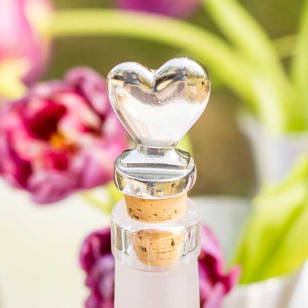 pewter heart-shaped bottle stopper in a wine bottle