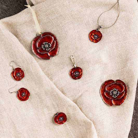 A collection of remembrance poppy themed jewelry