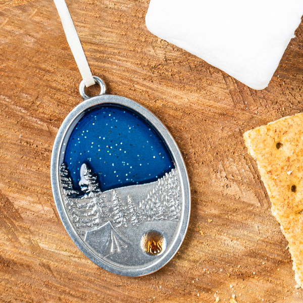 Ornament showing Tent under a blue starry sky with a campfire